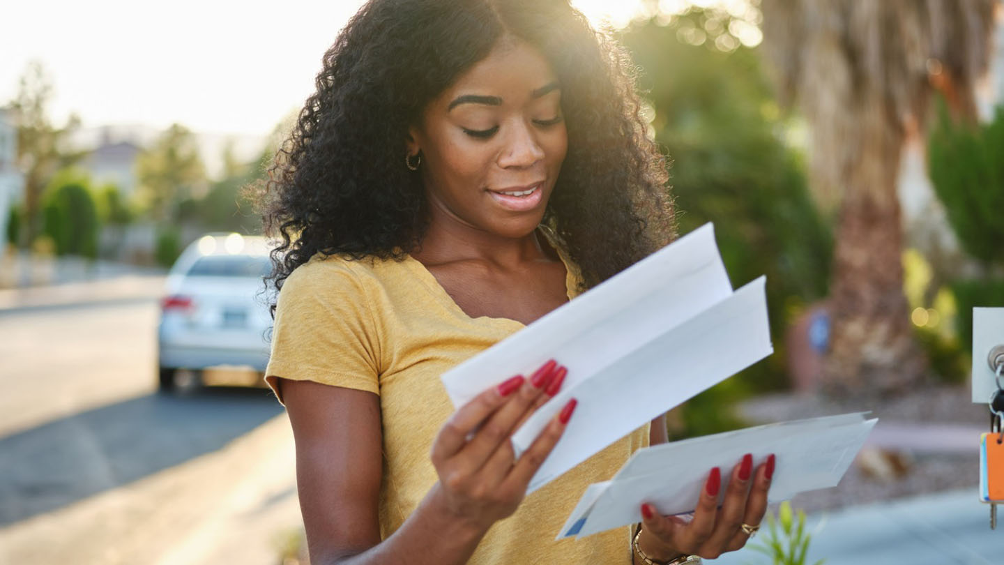 african american woman reading mail