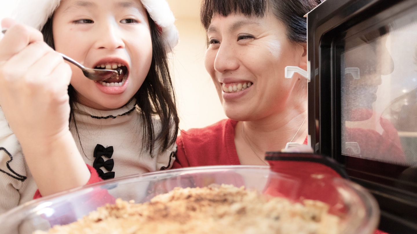 mother and daughter baking cake - apple crisp